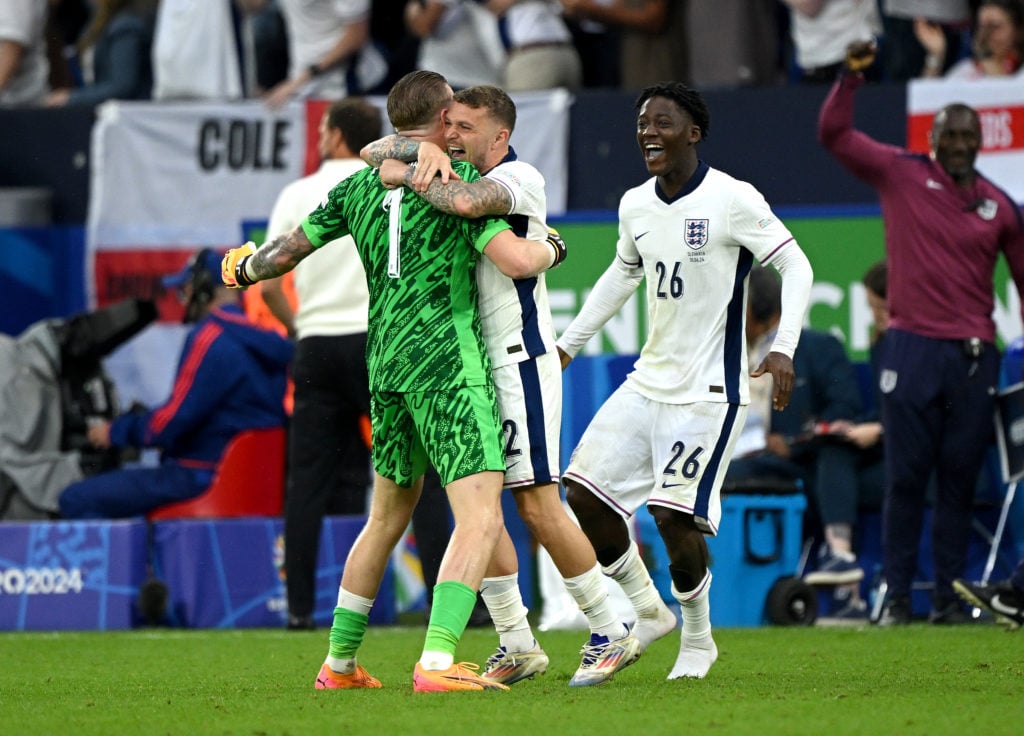 Jordan Pickford, Kieran Trippier and Kobbie Mainoo of England celebrate after their teammate Harry Kane (not pictured) scores their team's second g...