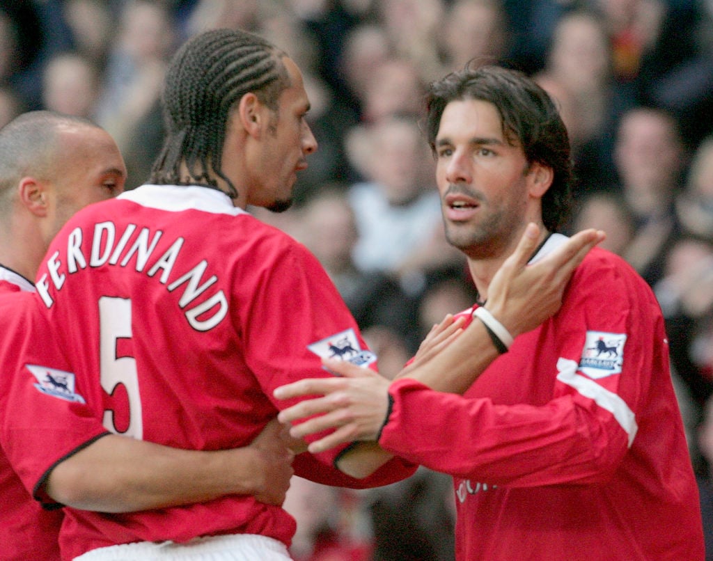 Ruud van Nistelrooy of Manchester United (R) celebrates scoring the first goal with Rio Ferdinand during the Barclays Premiership match between Man...