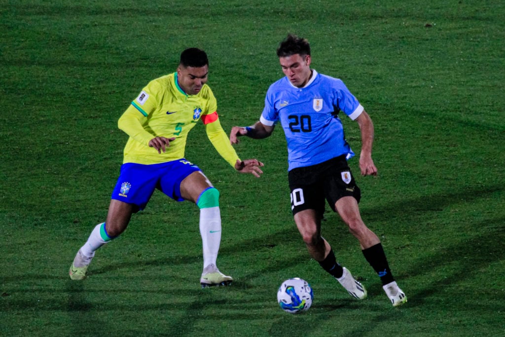 Carlos Casemiro of Brazil (L) chases Manuel Ugarte of Uruguay (R) during FIFA World Cup 2026 Qualifier match between Uruguay and Brazil at Centenar...