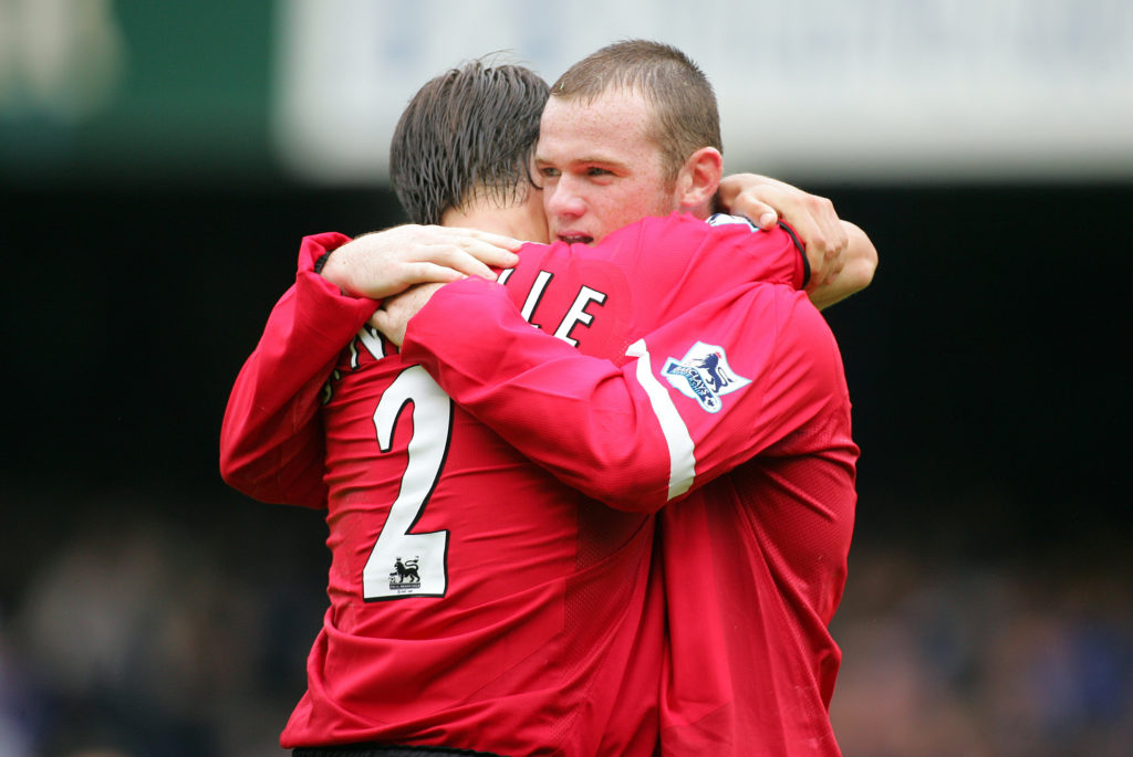 Gary Neville and Wayne Rooney hugging