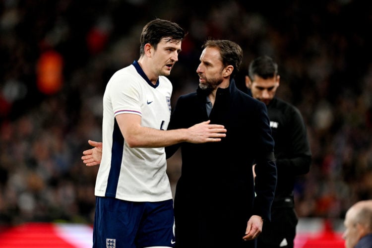 Gareth Southgate, Manager of England men's senior team, talks to Harry Maguire of England as he is substituted during the international friendly ma...