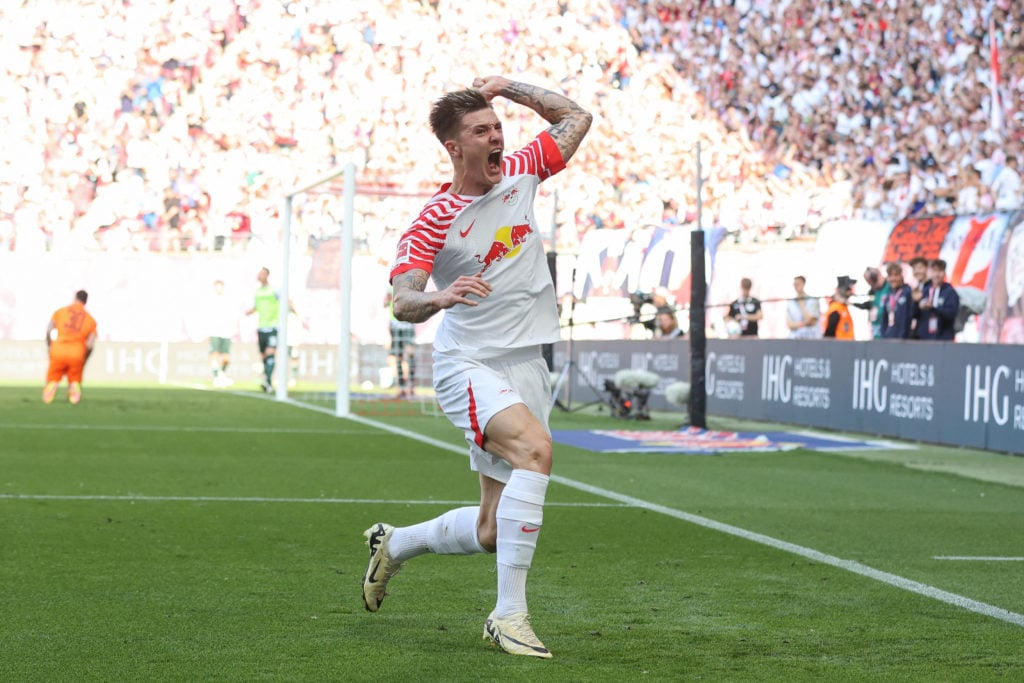 Benjamin Sesko celebrates scoring for RB Leipzig.