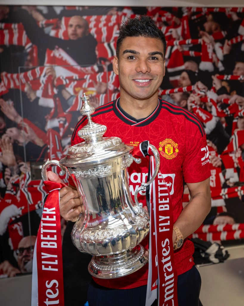 Casemiro of Manchester United celebrates in the dressing room with the Emirates FA Cup trophy after winning the Emirates FA Cup Final match between...