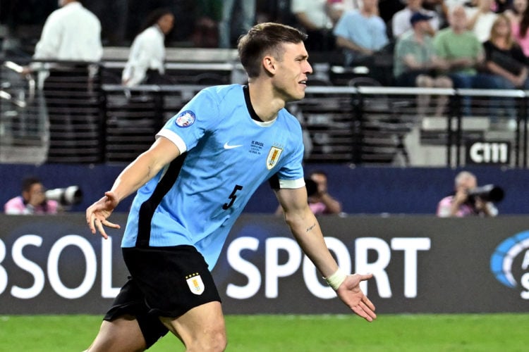 Uruguay's midfielder #05 Manuel Ugarte celebrates after scoring in a penalty shoot-out to win the Conmebol 2024 Copa America tournament quarterfina...