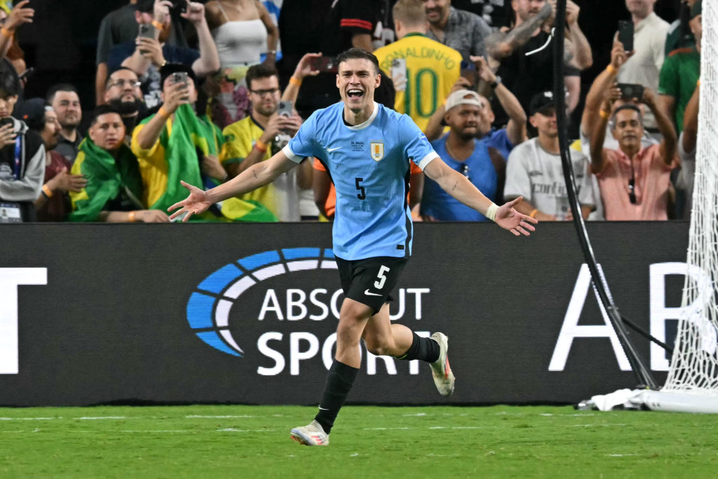 TOPSHOT - Uruguay's midfielder #05 Manuel Ugarte celebrates after scoring in a penalty shoot-out to win the Conmebol 2024 Copa America tournament q...