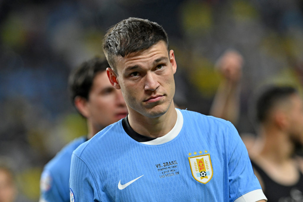 Midfielder no.  Uruguay's 05 Manuel Ugarte watches his side's victory in the quarter-finals of the Conmebol 2024 Copa America...