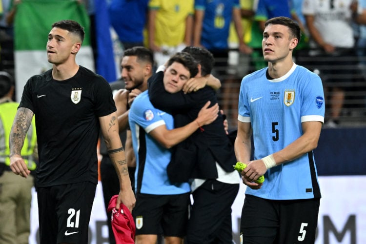 Uruguay's midfielder #21 Emiliano Martinez, Uruguay's forward #11 Facundo Pellistri (C) and Uruguay's midfielder #05 Manuel Ugarte celebrate their ...