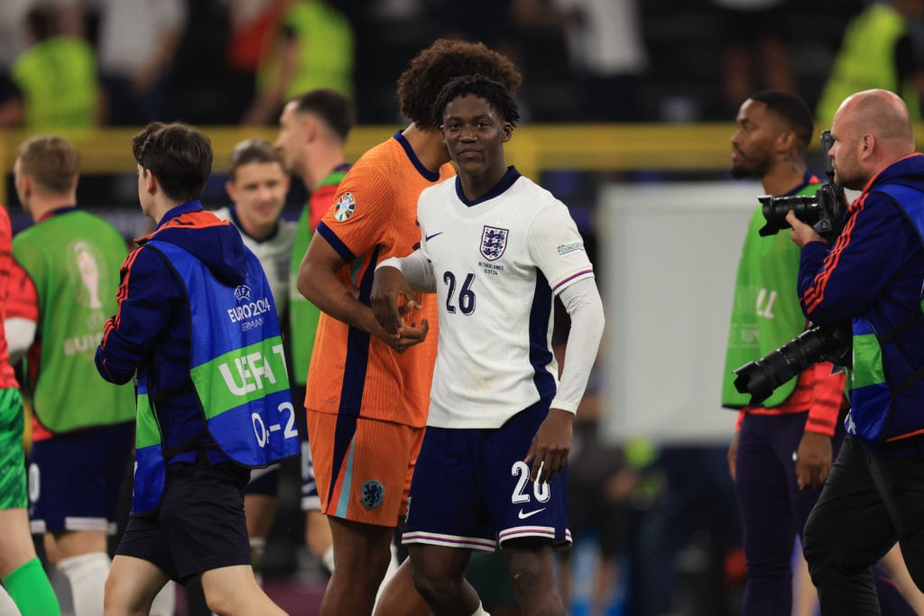 Kobbie Mainoo (England) is commiserating with Joshua Zirkzee (Netherlands) after the Semi Final of the UEFA European Championship between England a...