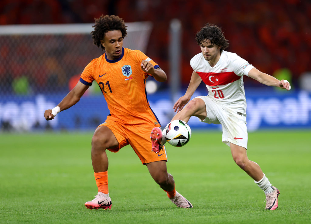 Turkey's Ferdi Kadioglu controls the ball while under pressure from Netherlands' Joshua Zirkzee during the UEFA EURO 2024 quarter-final match...