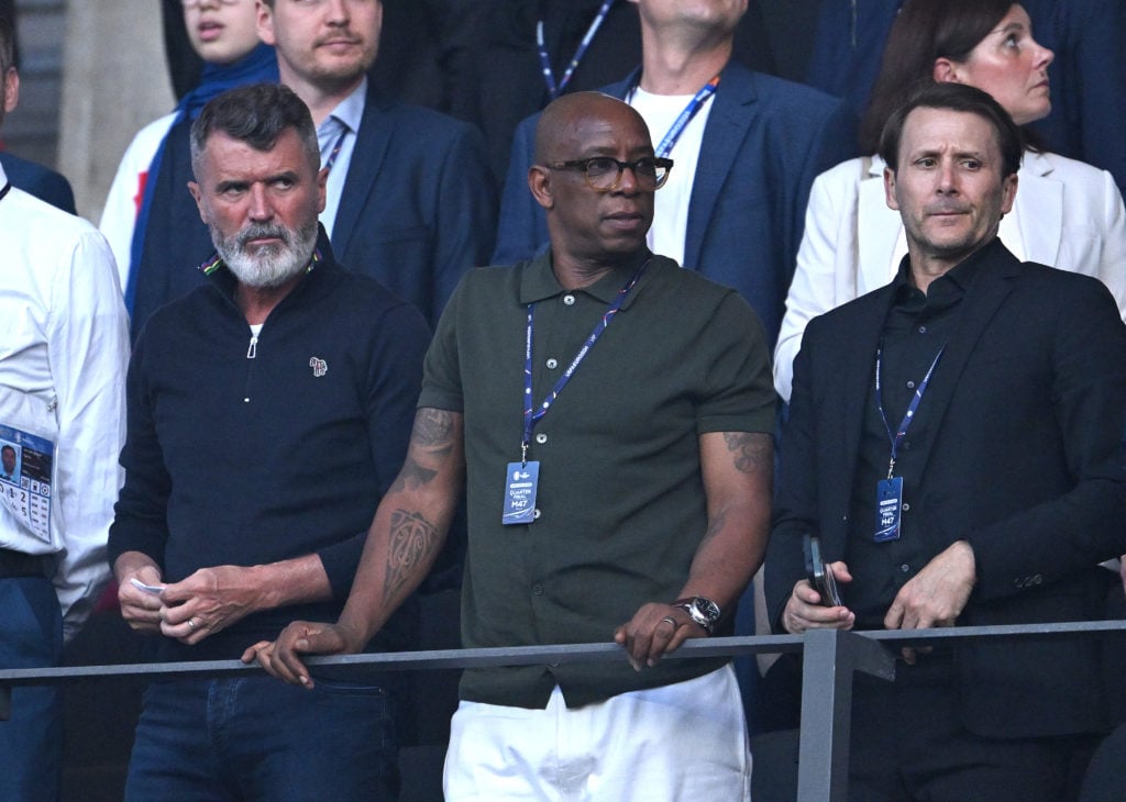 Former players and Television pundits, Ian Wright (c) and Roy Keane (l) look on from the stand during the UEFA EURO 2024 quarter-final match betwee...