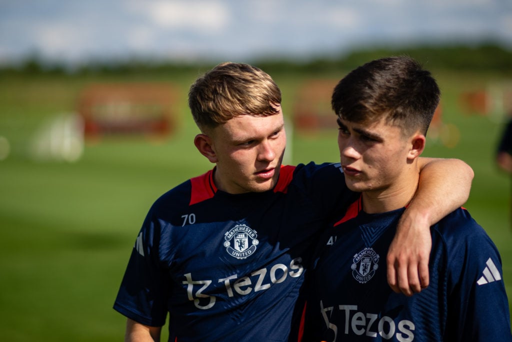 (EXCLUSIVE COVERAGE)  Finlay McAllister, Harry Amass of Manchester United in action during a first team training session at Carrington Training Gro...