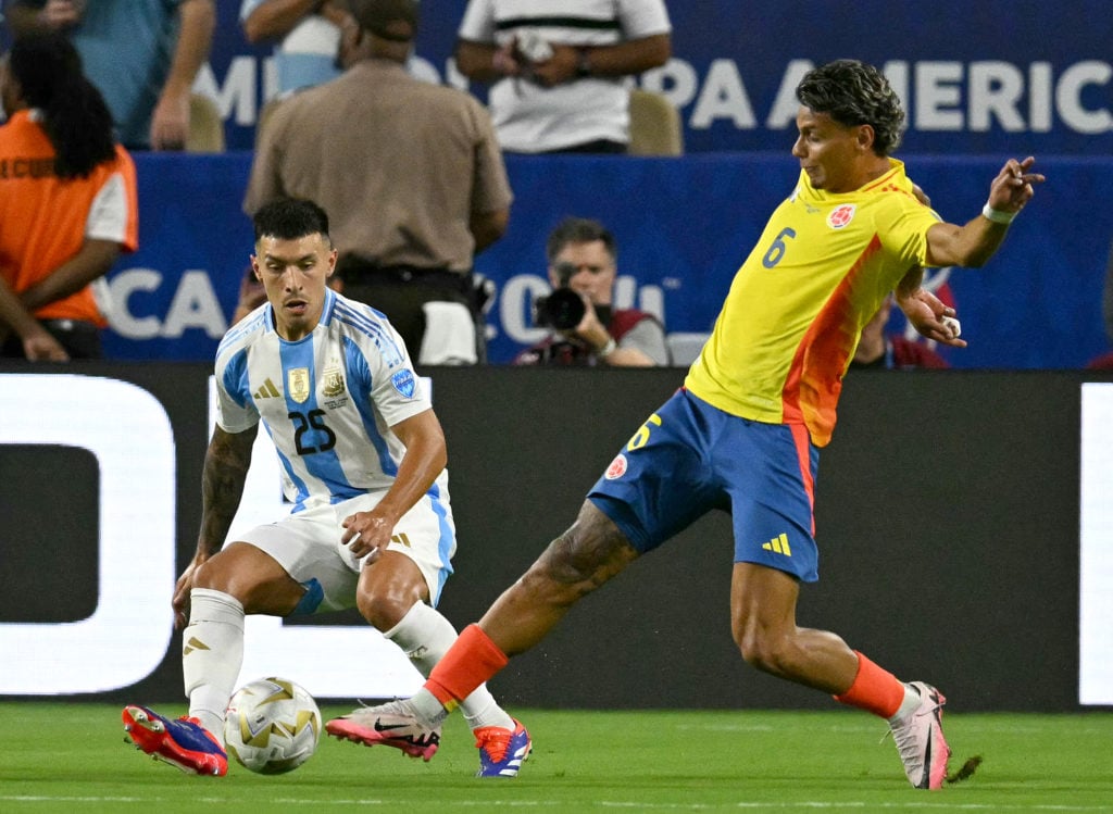 Argentina's defender #25 Lisandro Martinez fights for the ball with Colombia's midfielder #06 Richard Rios during the Conmebol 2024 Copa America to...