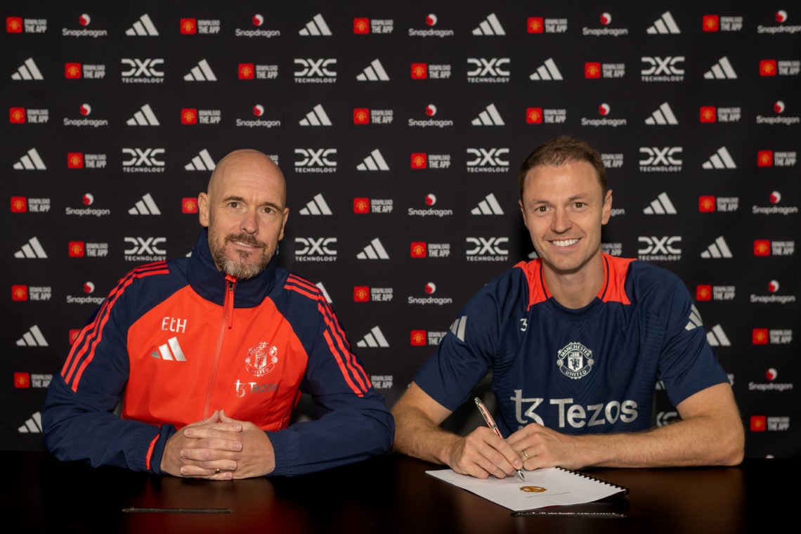 (EXCLUSIVE COVERAGE) Jonny Evans of Manchester United poses with Manager Erik ten Hag after signing a contract extension at Carrington Training Gro...