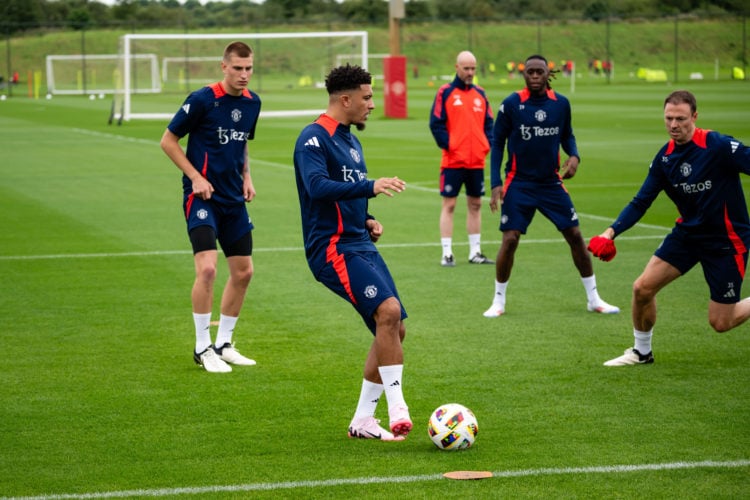 Rhys Bennett, Jadon Sancho, Aaron Wan-Bissaka and Jonny Evans of Manchester United in action during a first team pre-season training session at Car...