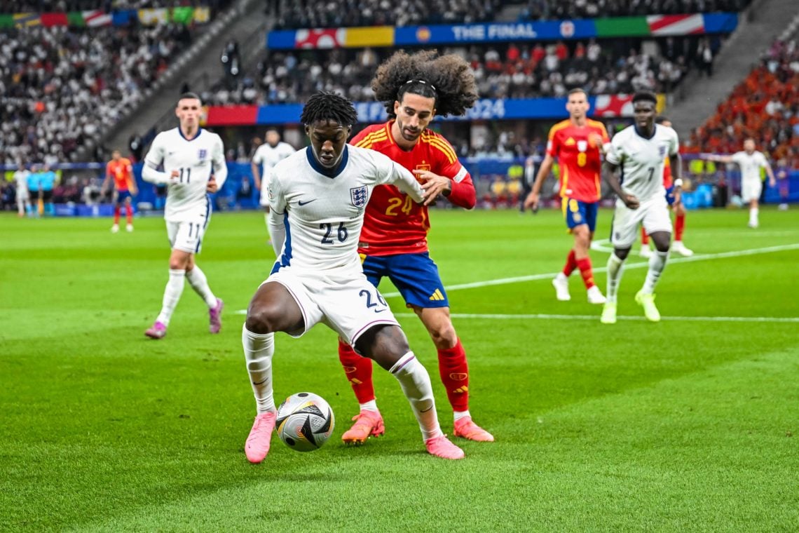 Kobbie Mainoo of England and Marc Cucurella of Spain in action during the UEFA EURO 2024 final match between Spain and England at Olympiastadion on...