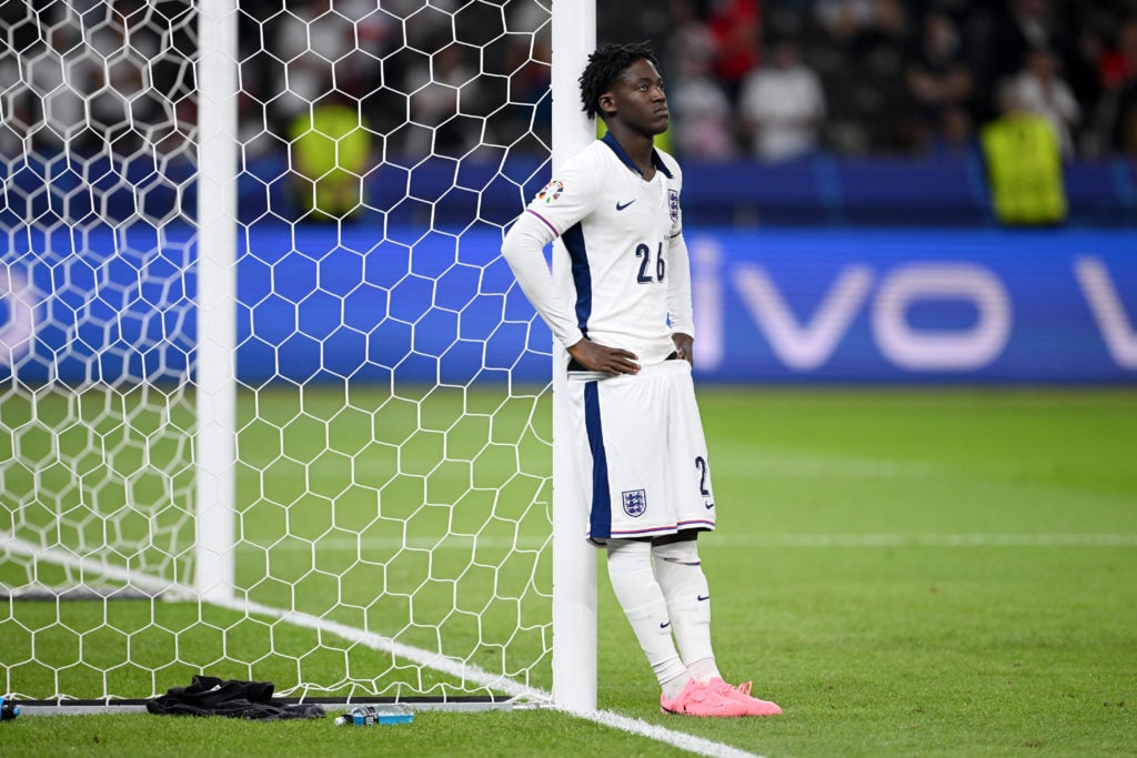 Kobbie Mainoo of England looks dejected as he reacts to defeat to Spain during the UEFA EURO 2024 final match between Spain and England at Olympias...