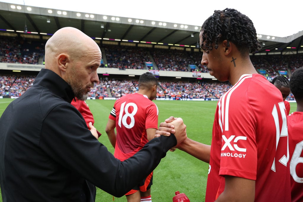 Manchester United manager Erik ten Hag talks to Leny Yoro ahead of the pre-season friendly between Manchester United and Glasgow Rangers...