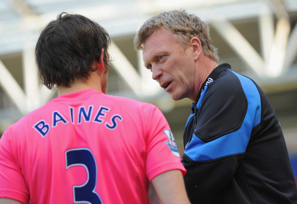 Everton manager David Moyes speaks to his player Leighton Baines before the Barclays Premier League match between Wigan and Everton at the DW Stadi...