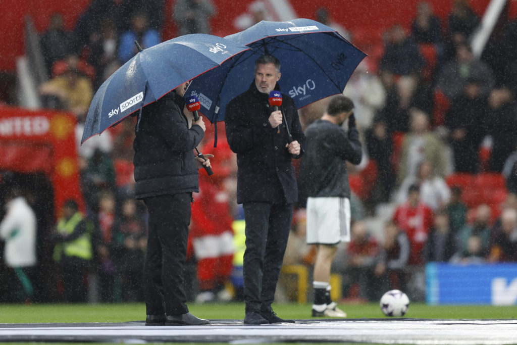 Gary Neville and Jamie Carragher of Sky Sports in the rain during the Premier League match between Manchester United and Liverpool FC at Old Traffo...