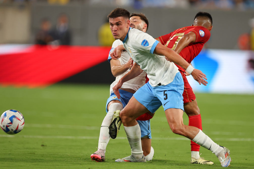 Manuel Ugarte #5 of Uruguay battles for the ball  during the first half of the CONMEBOL Copa America Group C game against Bolivia on June 27, 2024 ...