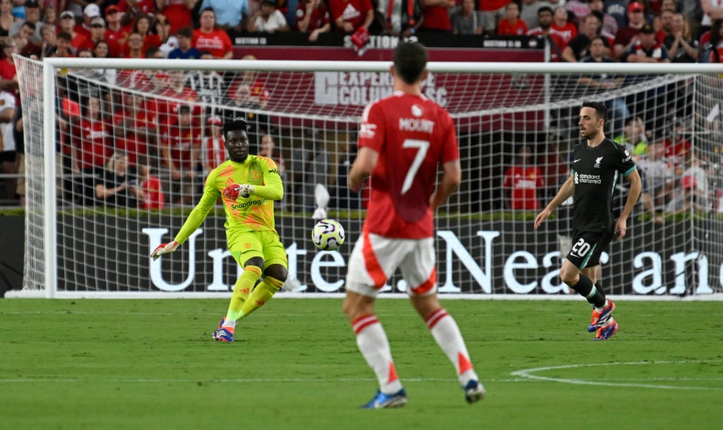 Manchester United's Cameroonian goalkeeper #24 Andre Onana eyes the ball during the pre-season club friendly football match between Manchester Unit...