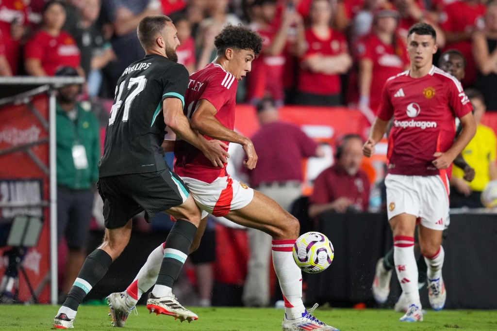 Nathaniel Phillips #47 of Liverpool defends Ethan Wheatley #36 of Manchester United during a pre-season friendly match at Williams-Brice Stadium on...