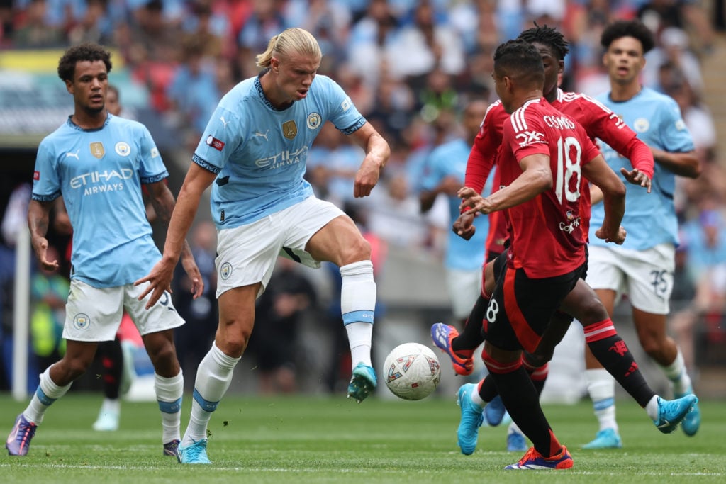 Erling Haaland of Manchester City and Casemiro of Manchester United challenge during the 2024 FA Community Shield match between Manchester United a...