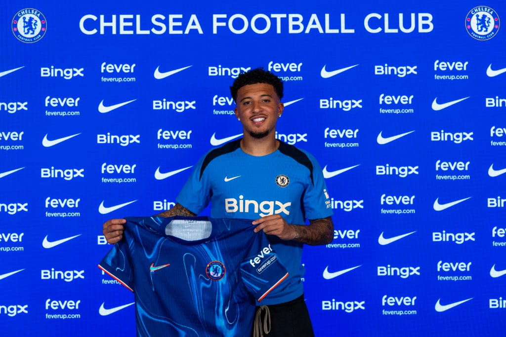 Jadon Sancho poses for pictures as he signs for Chelsea Football Club at Chelsea Training Ground on August 31, 2024 in Cobham, England.