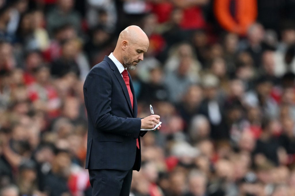 Erik ten Hag, Manager of Manchester United, writes on a notepad during the Premier League match between Manchester United FC and Liverpool FC at Ol...