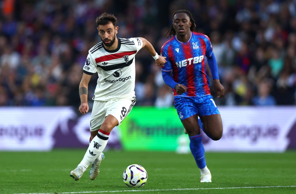 Bruno Fernandes of Manchester United and Eberchi Eze of Crystal Palace in action during the Premier League match between Crystal Palace FC and Man...