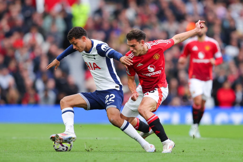 Brennan Johnson of Tottenham Hotspur battles for possession with Manuel Ugarte of MAnchester United during the Premier League match between Manches...