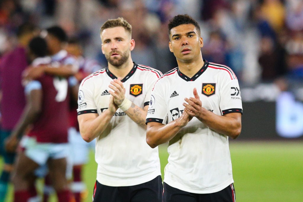 Casemiro and Luke Shaw of Manchester United applaud the fans after the Premier League match between West Ham United and Manchester United at London...