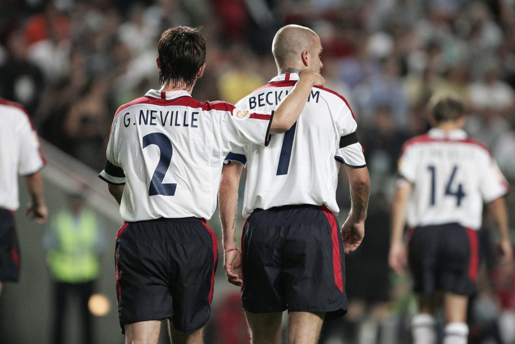 David Beckham of England and Gary Neville walk away after missing a penalty during the UEFA Euro 2004 quarter-final match between Portugal and England on...