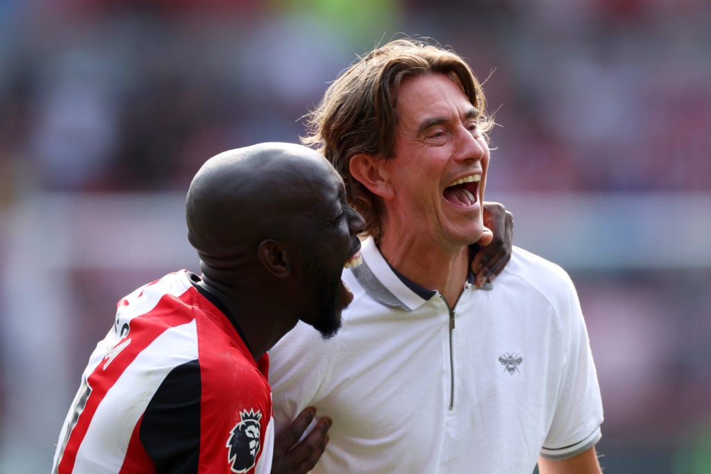 Yoane Wissa of Brentford and Thomas Frank, Manager of Brentford, celebrate following the team's victory in the Premier League match between Brentfo...