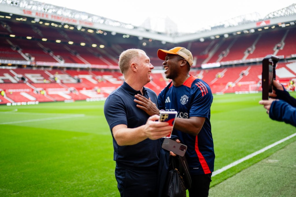 Paul Scholes of Manchester United Legends greets Eric Djemba-Djemba prior to the Legends match between Manchester United Legends and Celtic Legends...