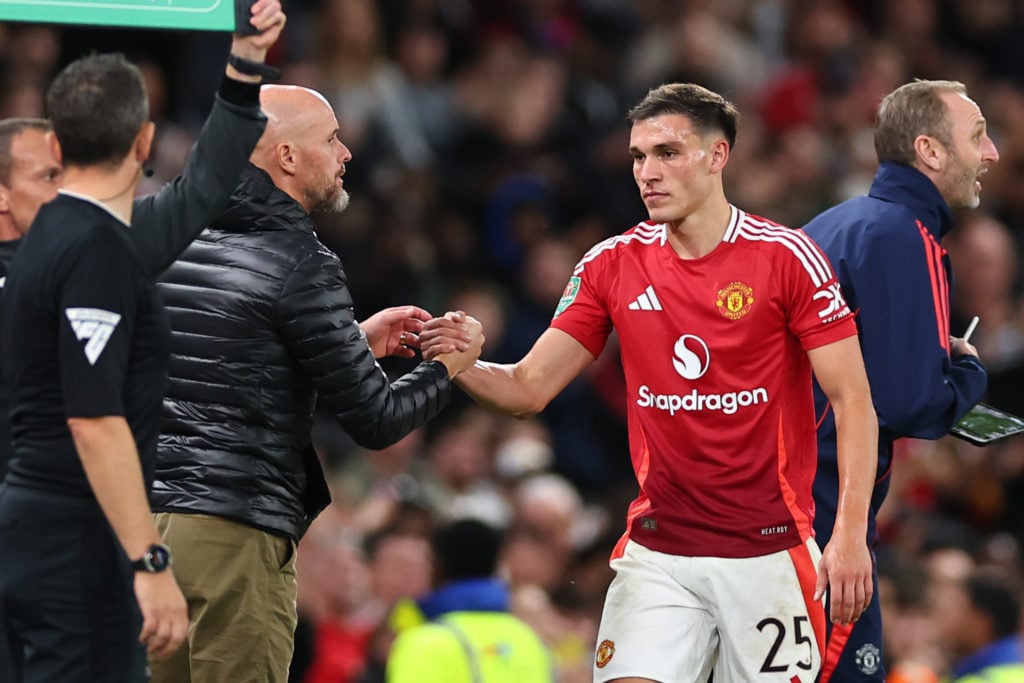 Manchester United head coach/manager Erik ten Hag and Manchester United's Manuel Ugarte during the Carabao Cup third round match between...