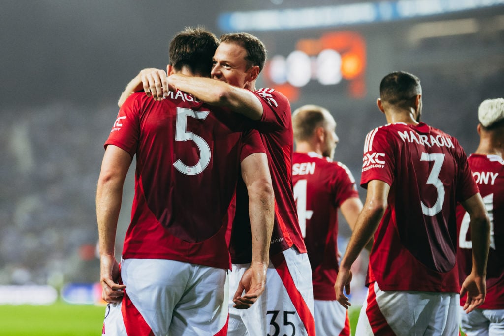 Harry Maguire of Manchester United celebrates scoring his sides third goal with team mate Jonny Evans during the UEFA Europa League 2024/25 League ...