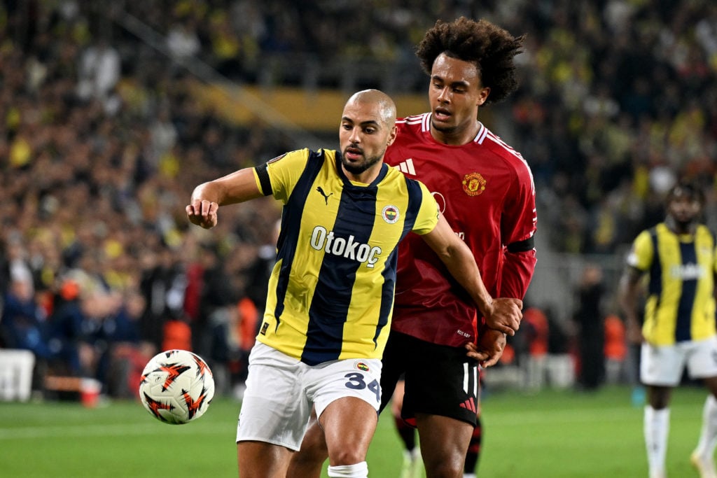 Sofyan Amrabat (34) of Fenerbahce in action against Joshua Zirkzee (L) of Manchester United during the UEFA Europa League week 3 football match bet...