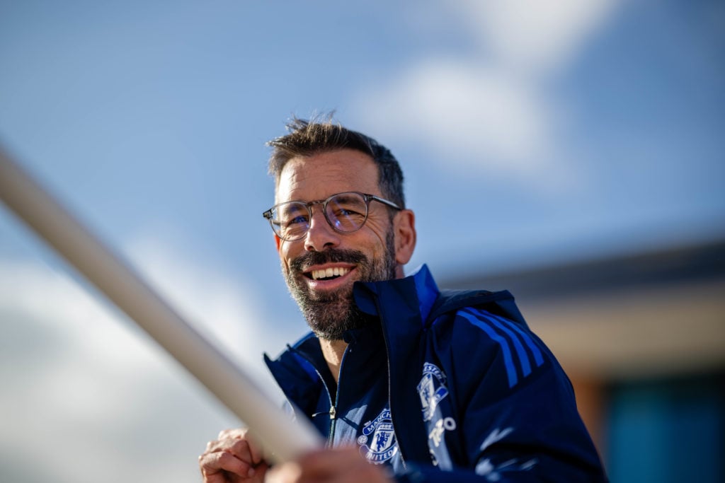 (EXCLUSIVE COVERAGE) Assistant manager Ruud van Nistelrooy of Manchester United checks in ahead of their flight to Istanbul at Manchester Airport o...