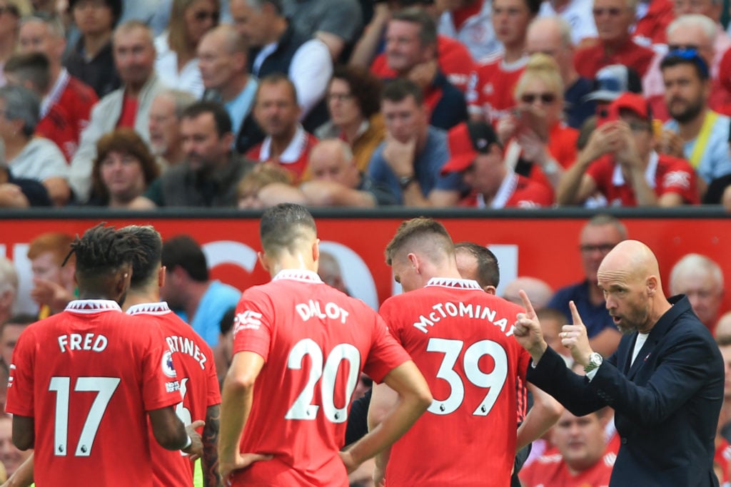 Manchester United's Dutch manager Erik ten Hag speaks to his players during the English Premier League football match between Manchester United and...