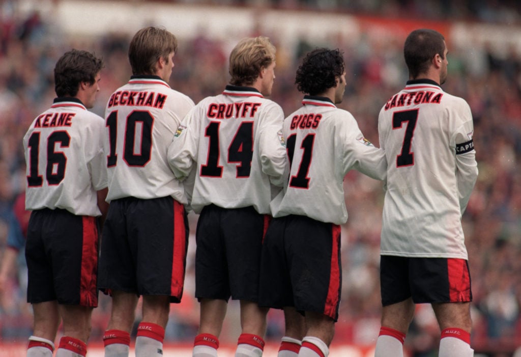 Manchester United wall with Eric Cantona and Roy Keane.