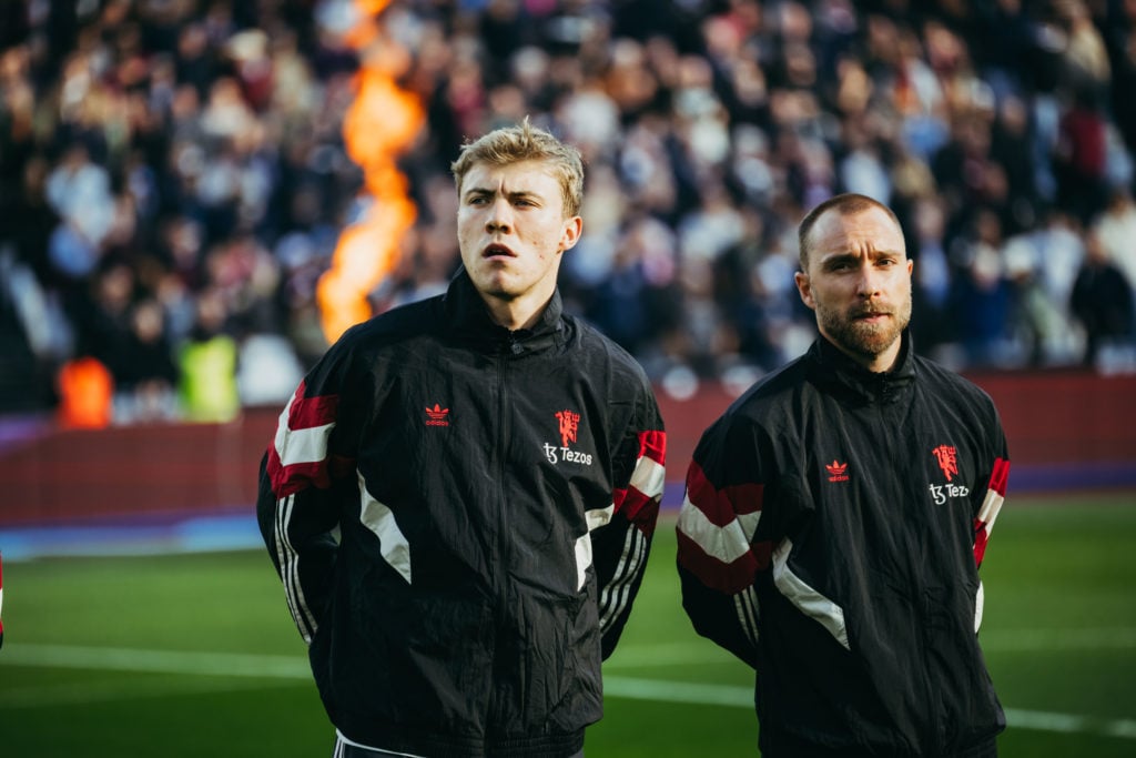 Manchester United's Christian Eriksen watches with Rasmus Hojlund ahead of the Premier League match between West Ham United FC and Manchester Uni...