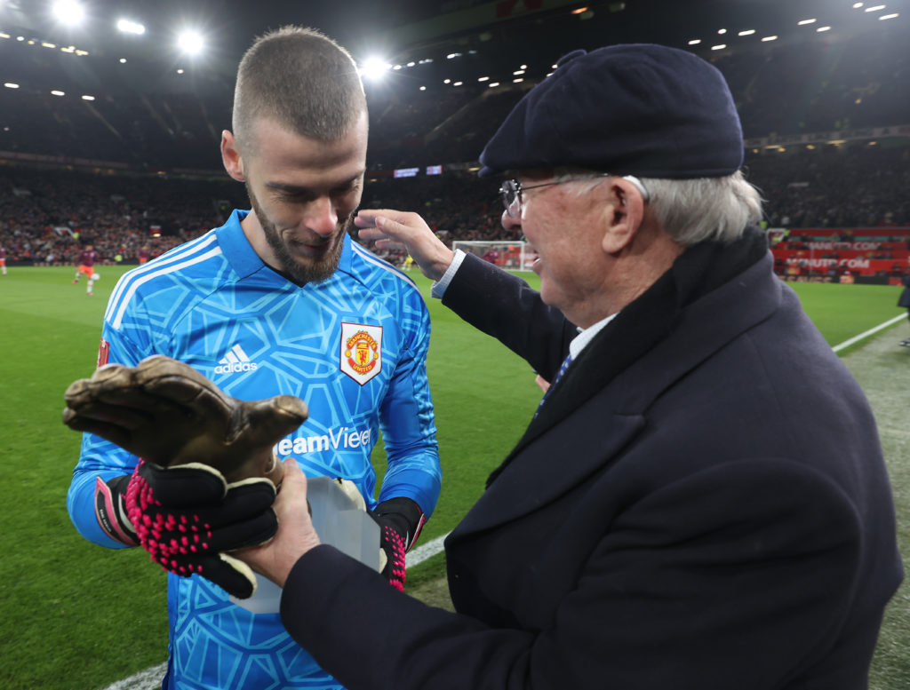 Sir Alex Ferguson hands David de Gea his golden glove award.