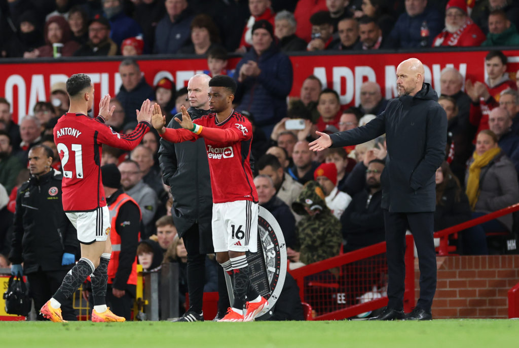 Amad Diallo of Manchester United enters the pitch as a substitute to replace team mate Antony as Erik ten Hag, Manager of Manchester United, looks on during the Premier League match between Manchester United and Sheffield United at Old Trafford on April 24, 2024