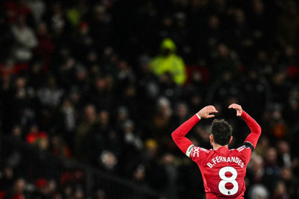 Manchester United's Portuguese midfielder #08 Bruno Fernandes (R) celebrates after scoring his team second goal during the English Premier League f...