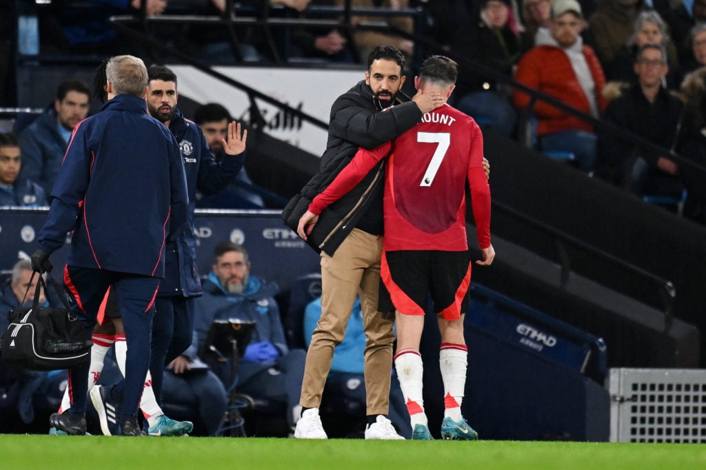 Mason Mount of Manchester United is consoled by Ruben Amorim, Manager of Manchester United, as he leaves the pitch after picking up an injury durin...