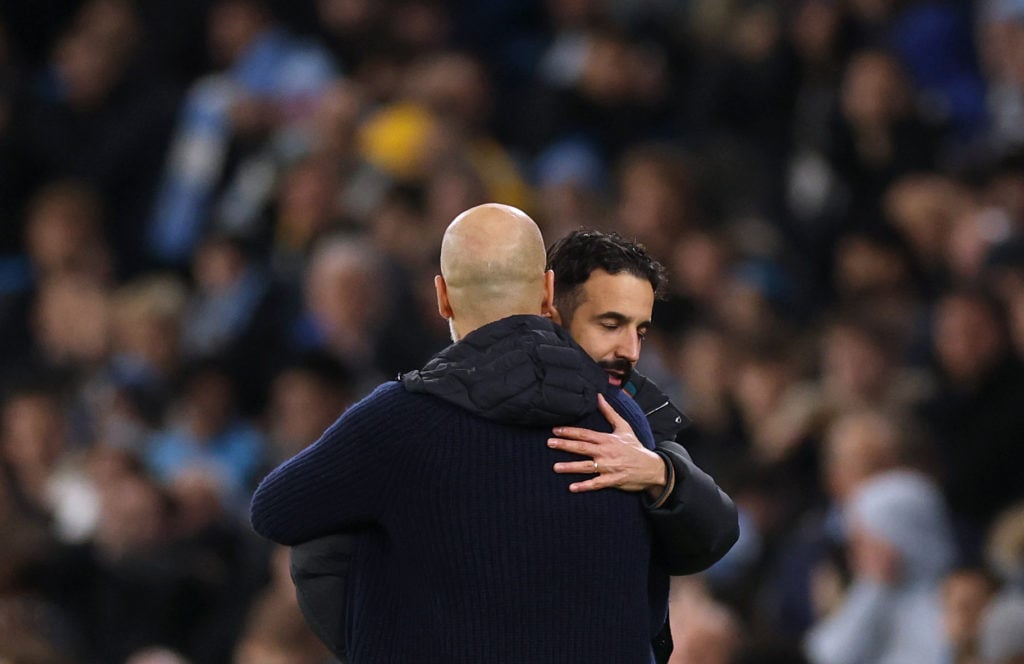 Ruben Amorim, Manager of Manchester United, embraces Pep Guardiola, Manager of Manchester City, after the Premier League match between Manchester City FC and Manchester United FC at Etihad Stadium on December 15, 2024