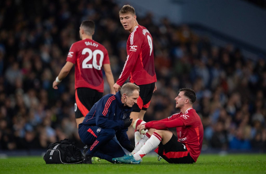 Mason Mount of Manchester United receives treatment from the physiotherapist for an injury during the Premier League match between Manchester City ...