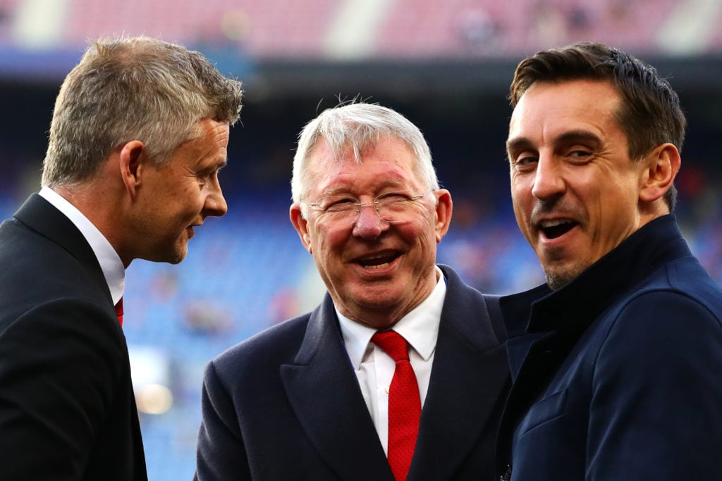 Sir Alex Ferguson talks with Manager of Manchester United Ole Gunnar Solskjaer and Gary Neville before the UEFA Champions League Quarter Final seco...