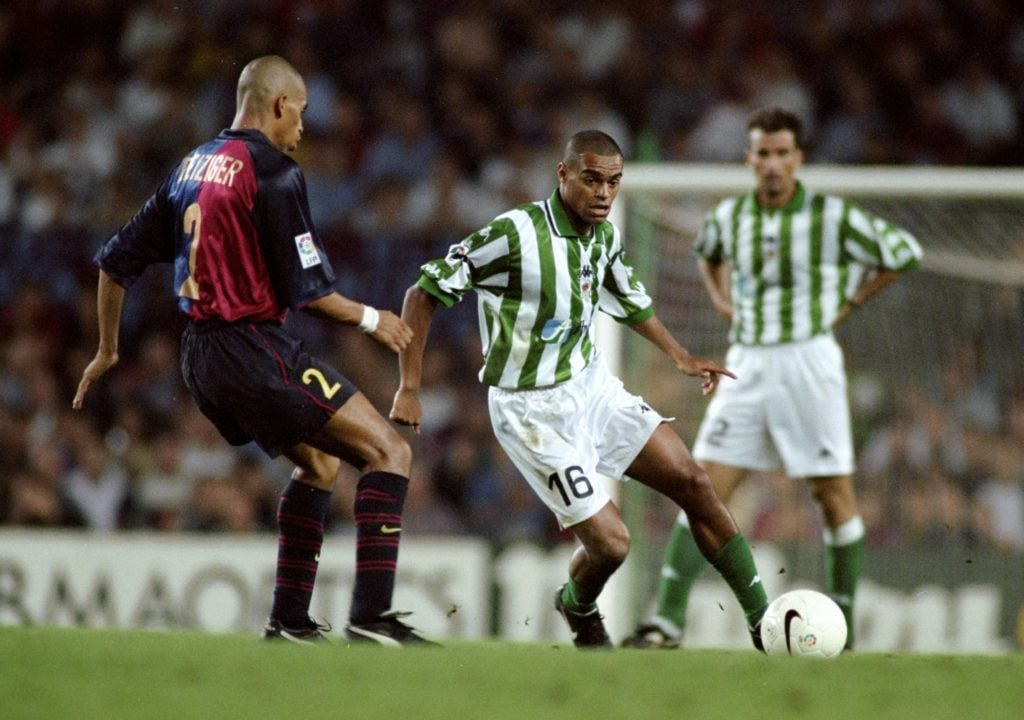 Denilson of Real Betis Michael Reiziger of Barcelona